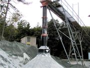 Loading spout for open pile loading